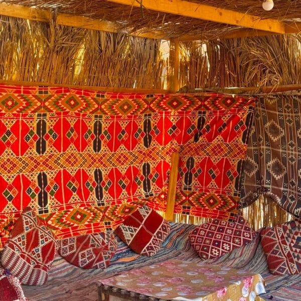 Quad 3 Hours Safari Hurghada featuring the cozy interior of a traditional Bedouin tent with colorful cushions
