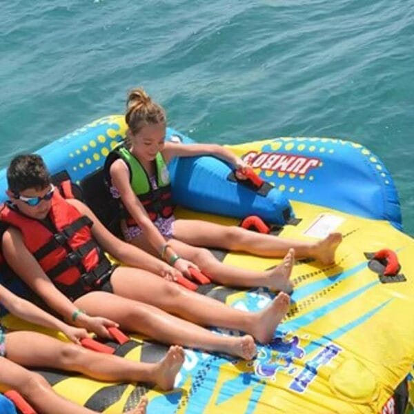 Banana and Sofa Boat Hurghada: Children wearing life jackets enjoying a thrilling sofa boat ride on the blue waters of the Red Sea