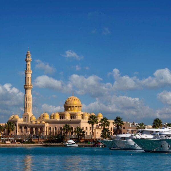 The stunning El Mina Mosque with its tall minarets overlooking the yachts and turquoise waters of the Hurghada Marina.